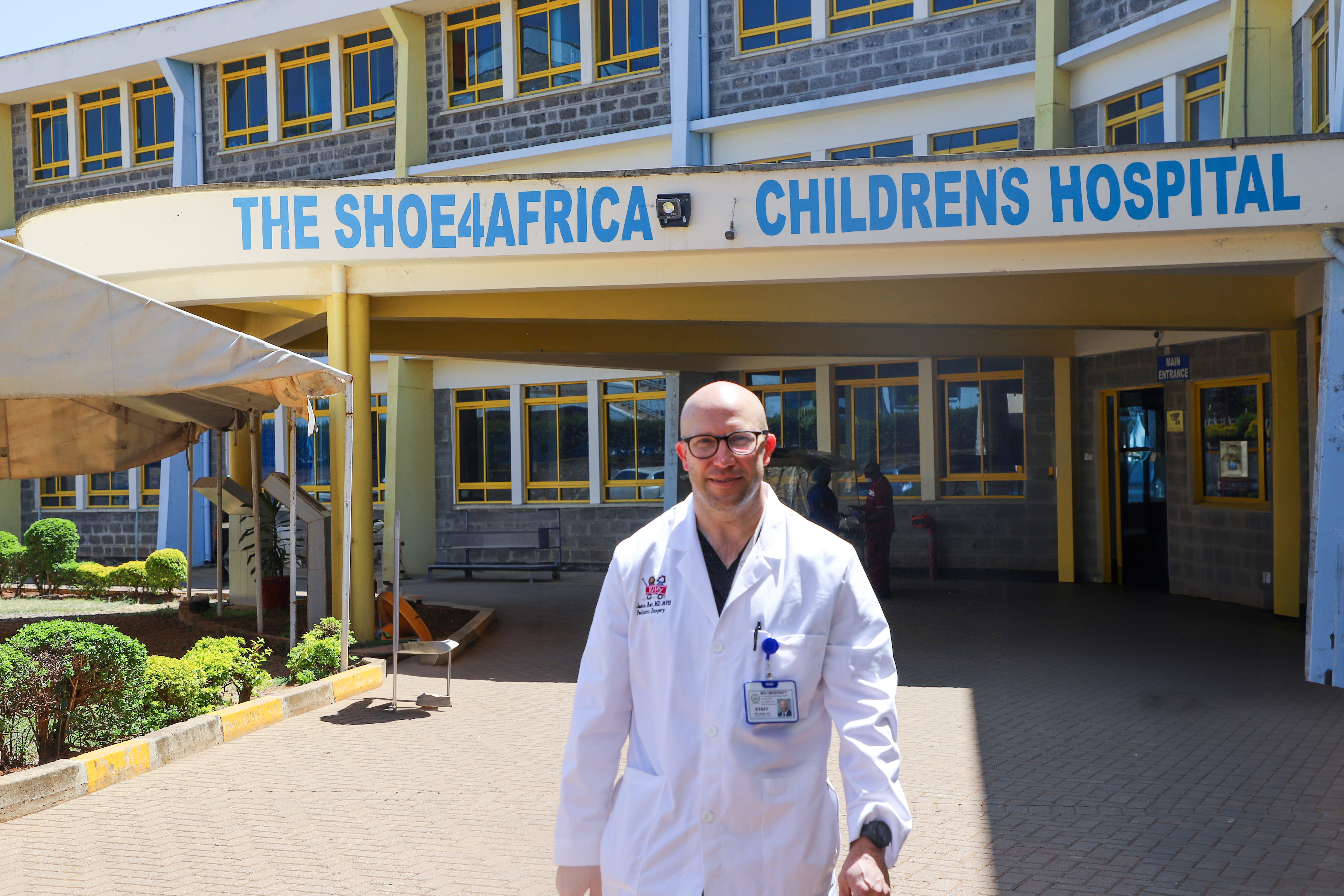 A guy standing in front of a building