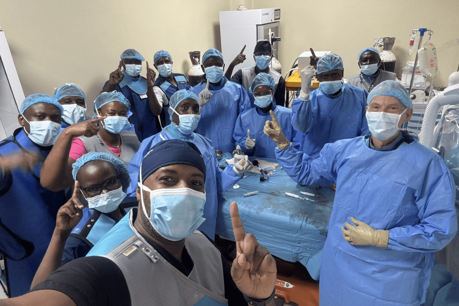 A group of IR radiologists pose for a group photo.