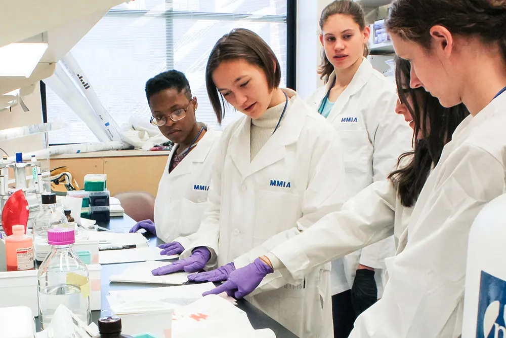 Group of MMIA students receiving experiment instructions