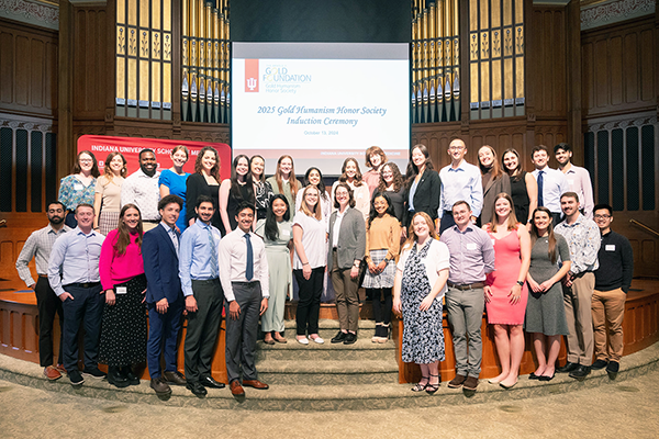 GHHS student award winners at IU School of Medicine pose on-stage for a photo together.