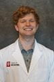 quen deckbar in a white coat