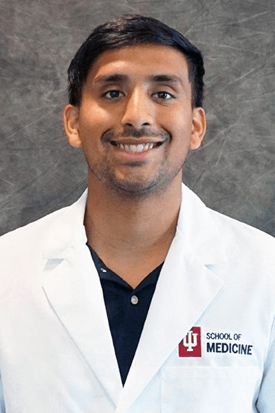 Eddie Velez in a white coat