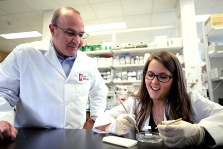 Alan Palkowitz, MD, oversees work with a member of his lab