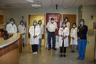 The Diabetic Foot Consortium team poses for a photo with Donnell Hayes, the study's first patient. Diabetic Foot Consortium team