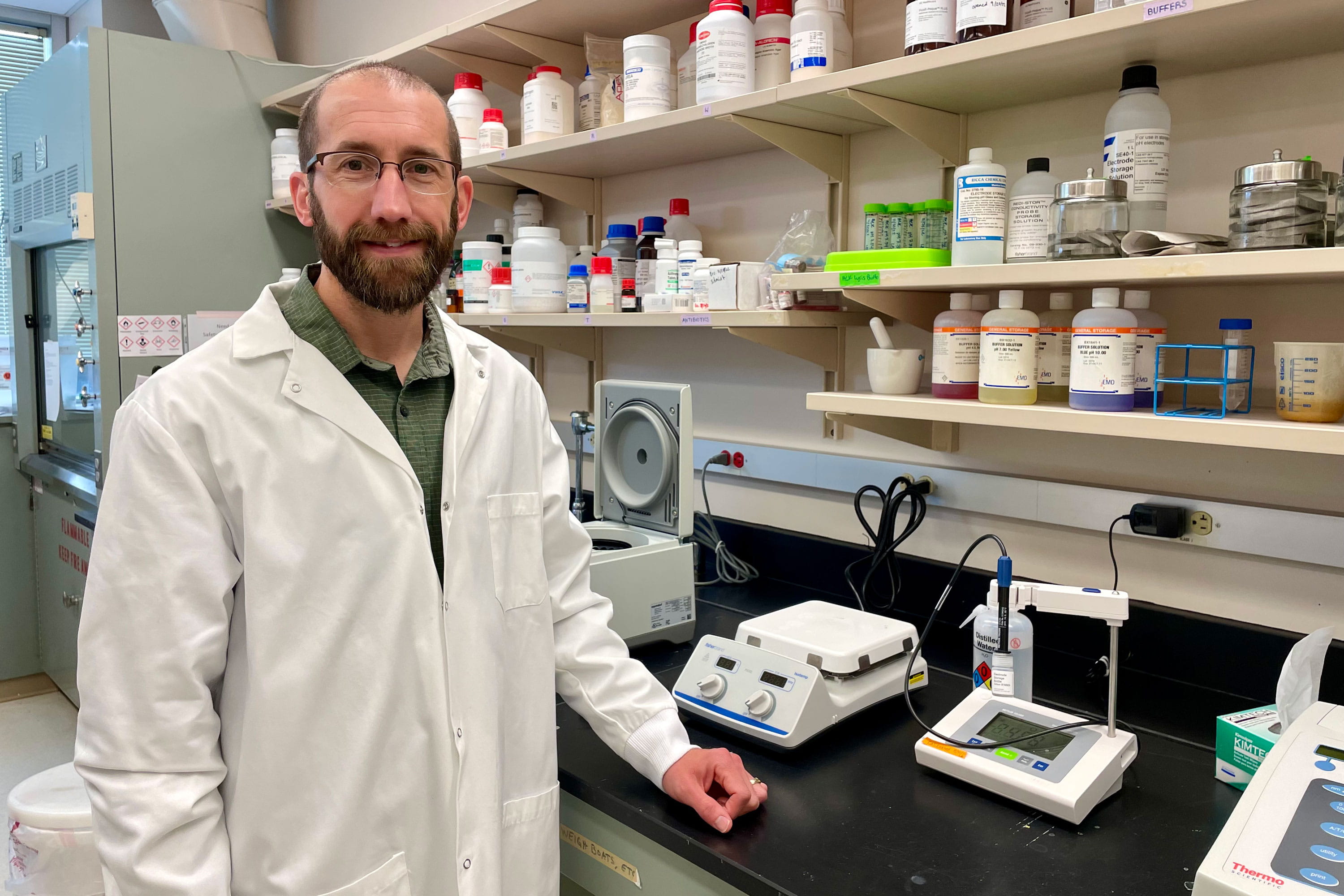 Nathan W. Schmidt stands in his research lab