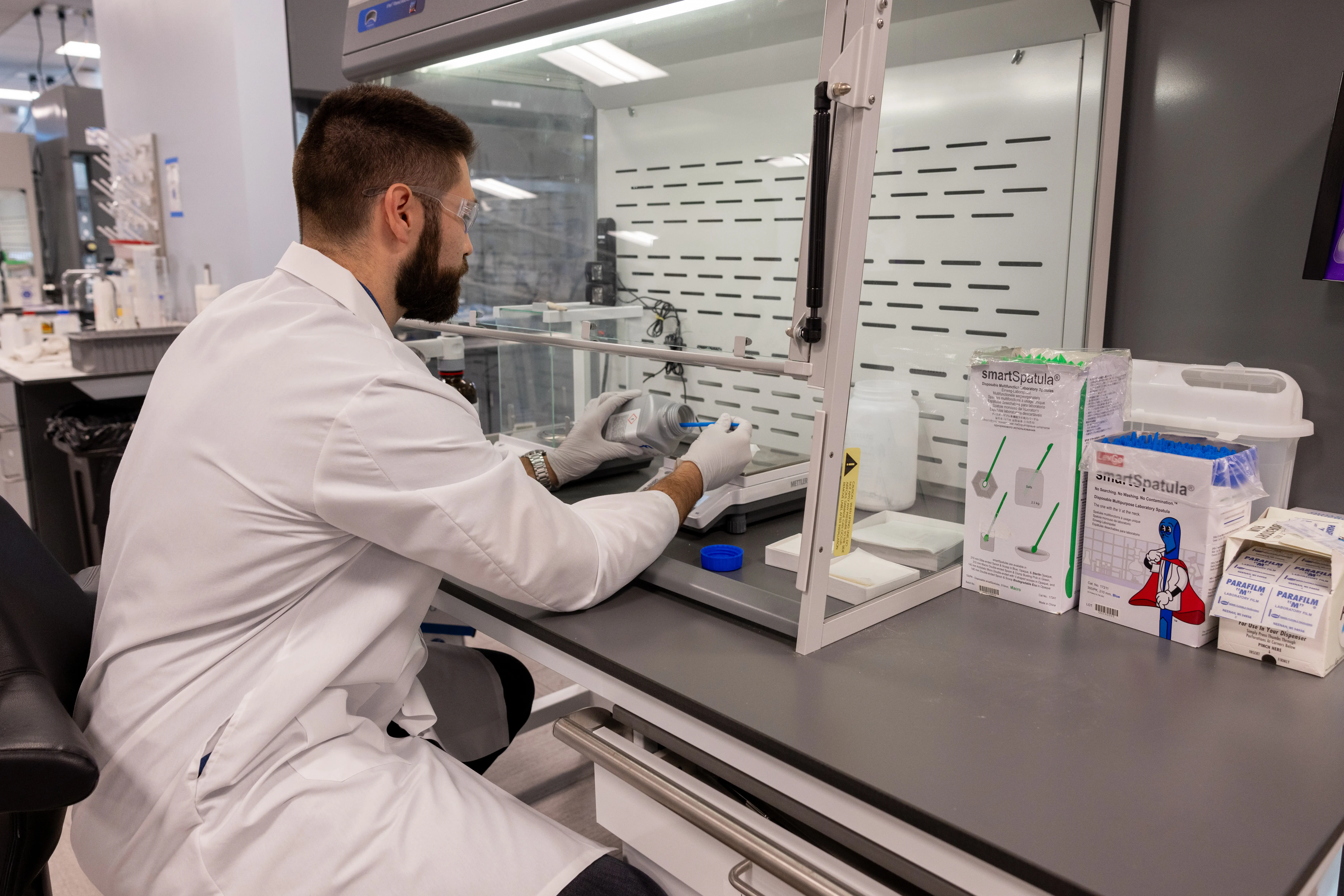 A scientist working at a research lab bench
