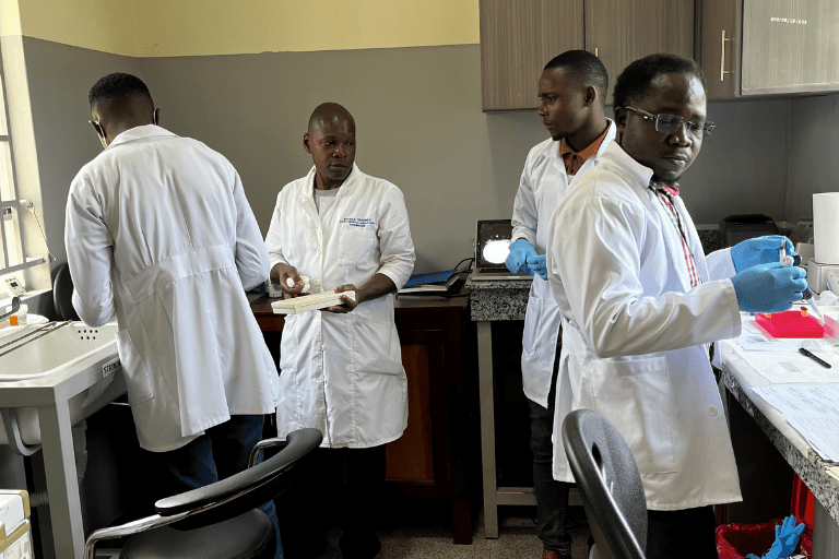 Four researchers working in a lab.