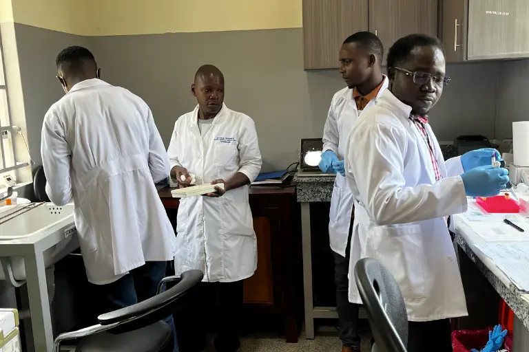 Four researchers working in a lab.
