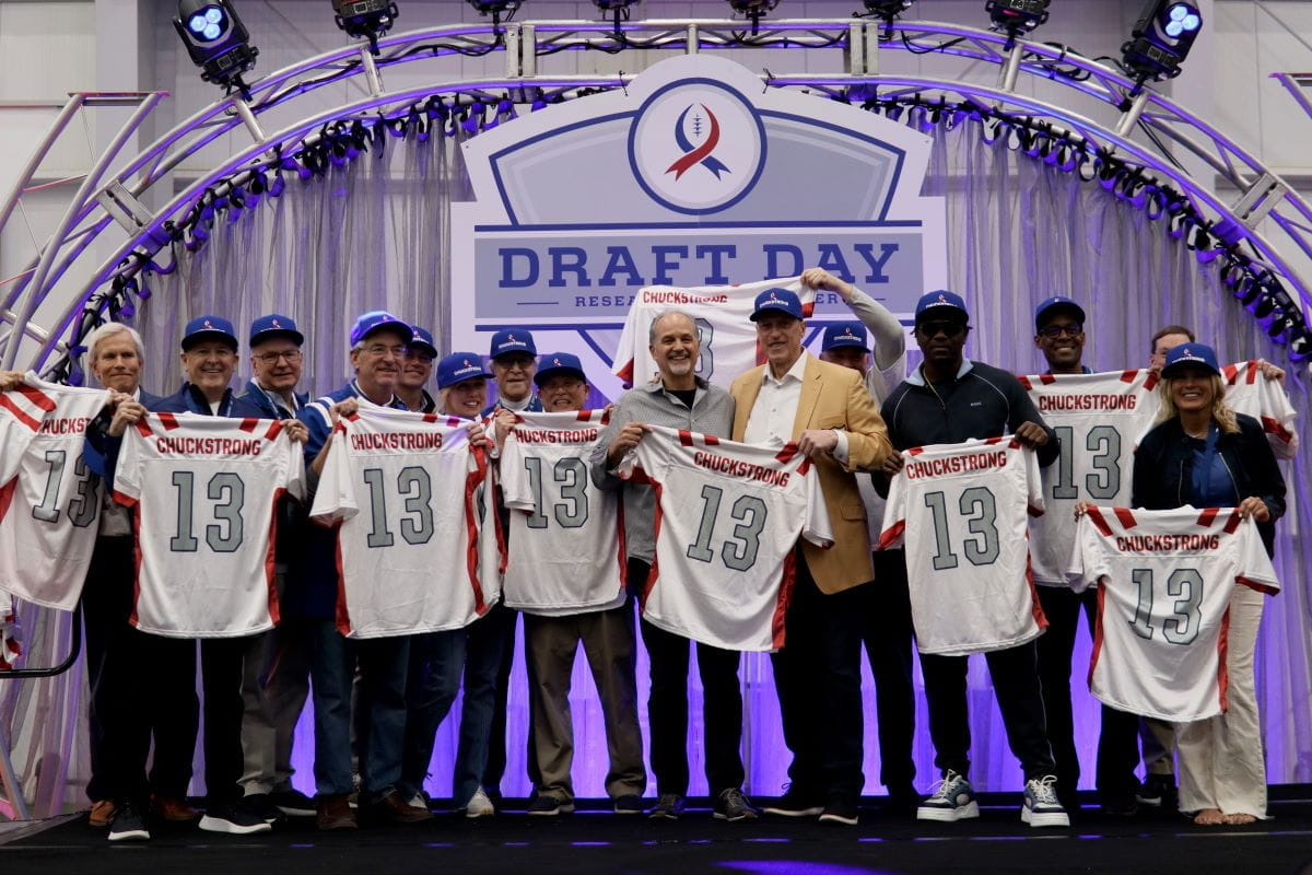 Chuck Pagano and Chuckstrong gala attendees pose with football jerseys