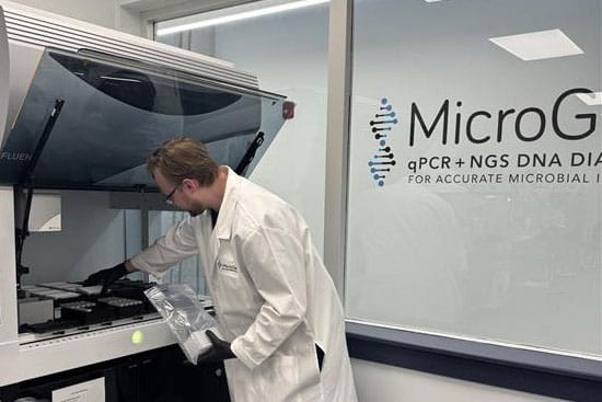 A scientists uses MicroGenDX technology