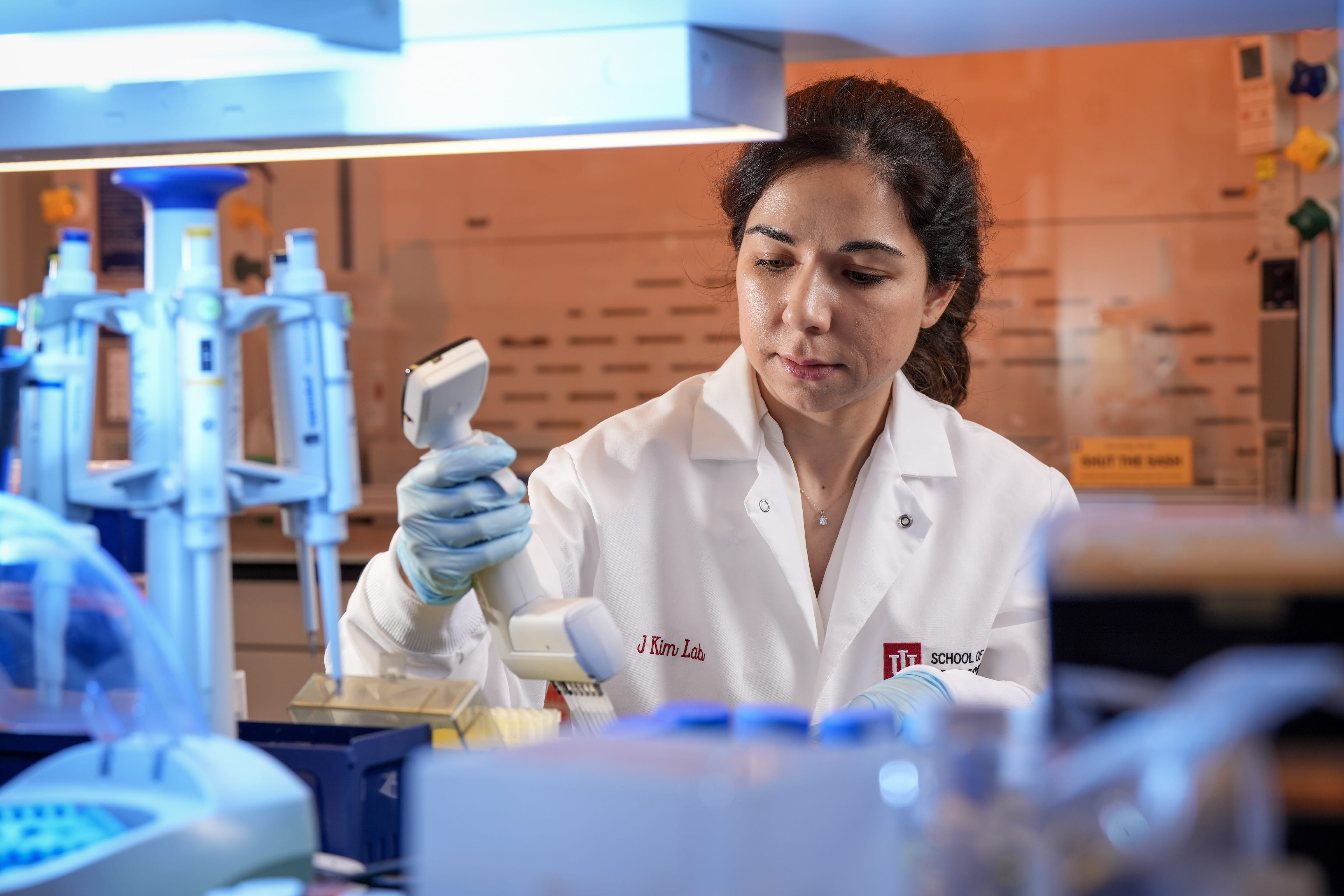 A woman works in her lab