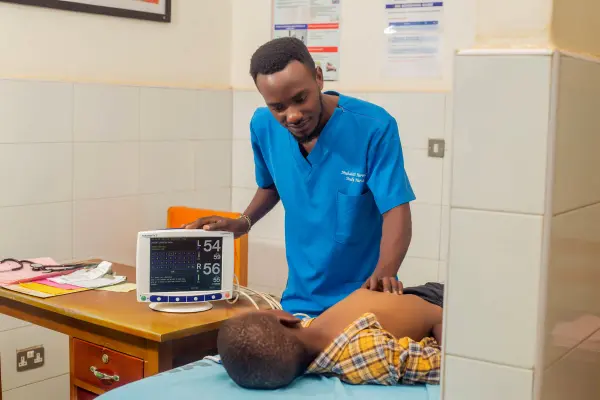 A nurse examines a child. 