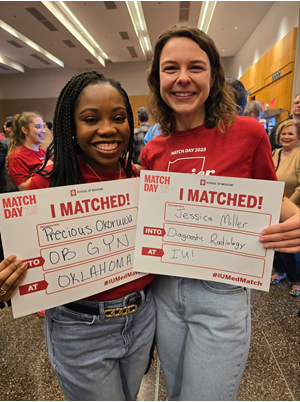 Okoruwa stands with her classmate during Match Day as Okoruwa matches into the OB-GYN program Okoruwa matching into OB-GYN