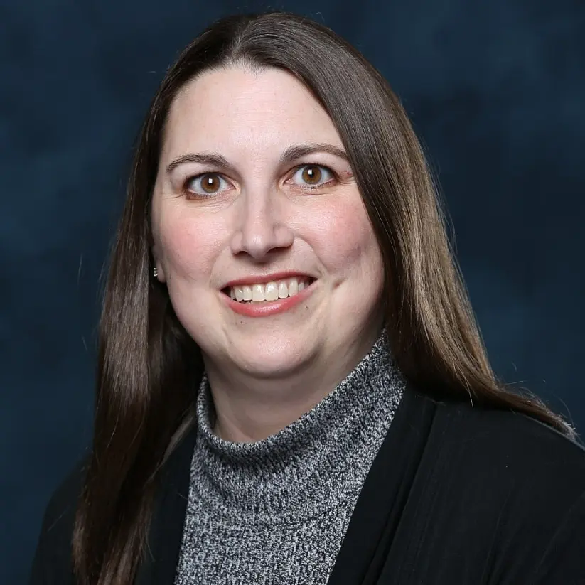 Sara Quinney smiles for her headshot 