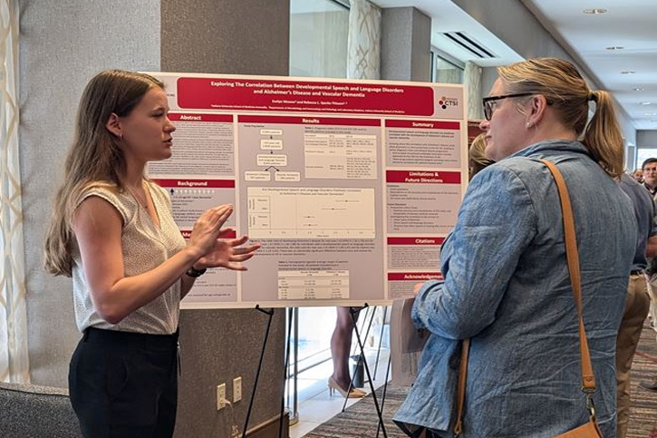 Student Presenting Research Poster