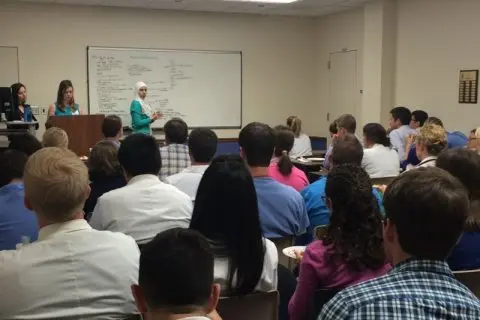 Group shot of students listening to a lecture