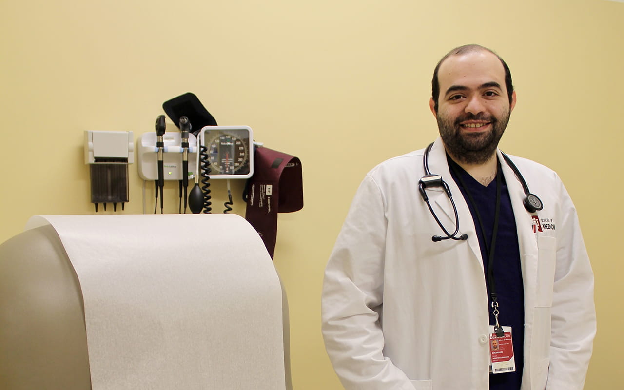 Dr. Hamed Chehab Standing in Front of Exam Chair