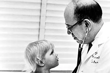 Morris Green treating a pediatric patient