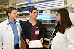 Faculty members discussing research. 