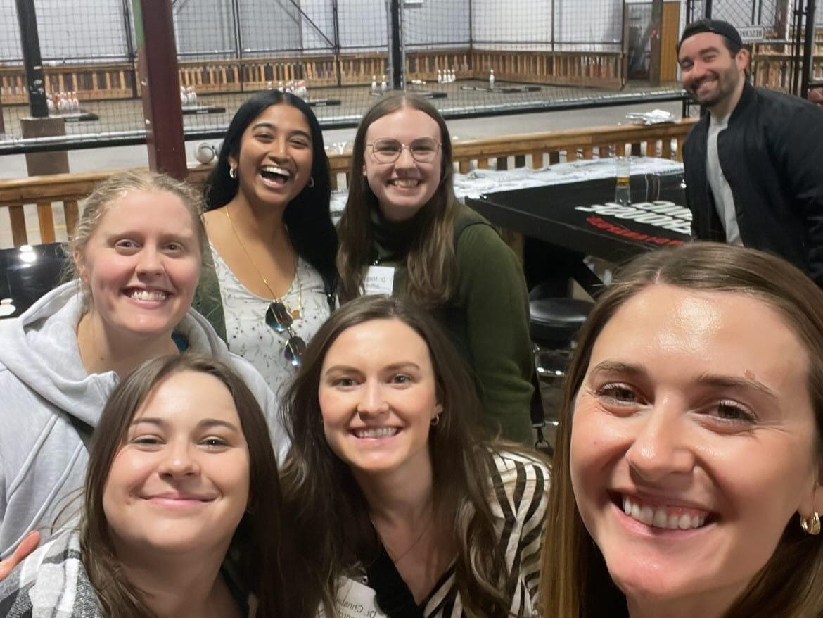 residents take a selfie at a bar