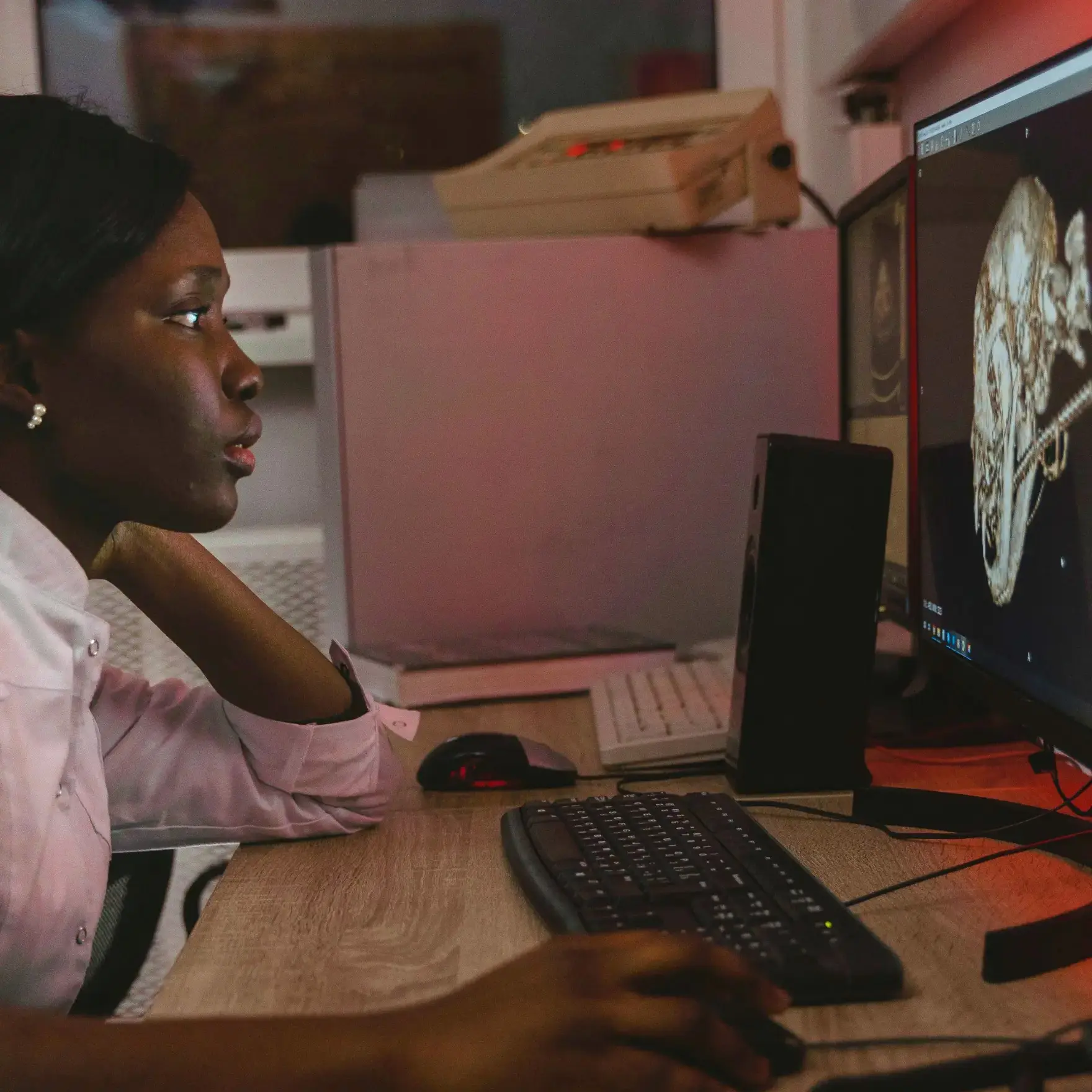 A female radiologist views neuro scans.