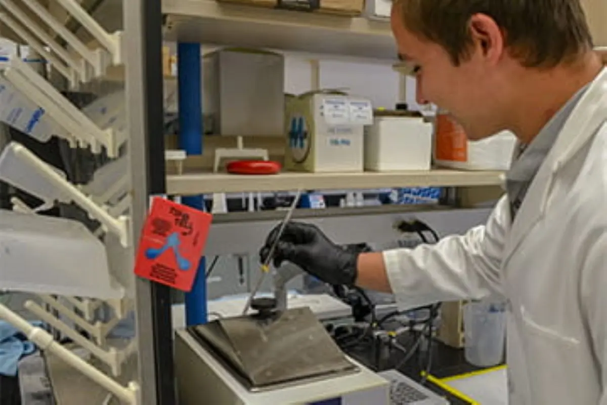 Lab technician performs experiments