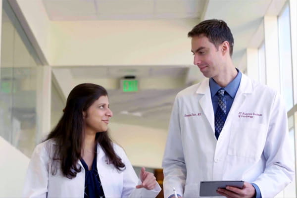 two cardiology fellows walk through the hospital talking