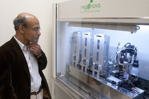 Dr. Nalim observes the regenova bioprinter