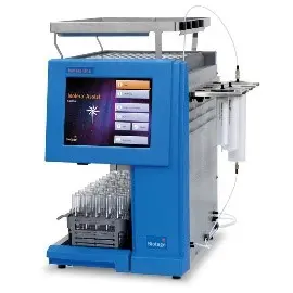 large blue instrument with a plate on top, large monitor screen and glassware on the bottom