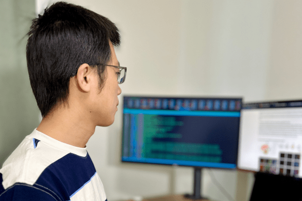 Yuan Liu sitting at computer