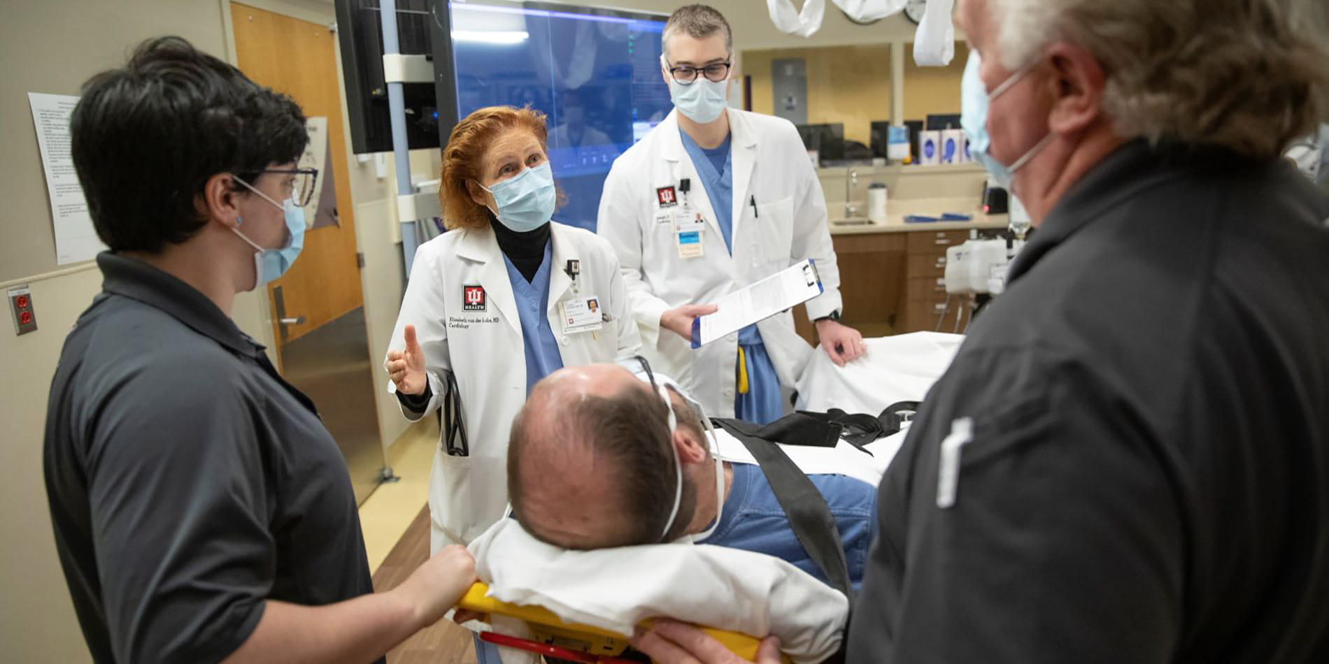 providers and a patient in cardiac care