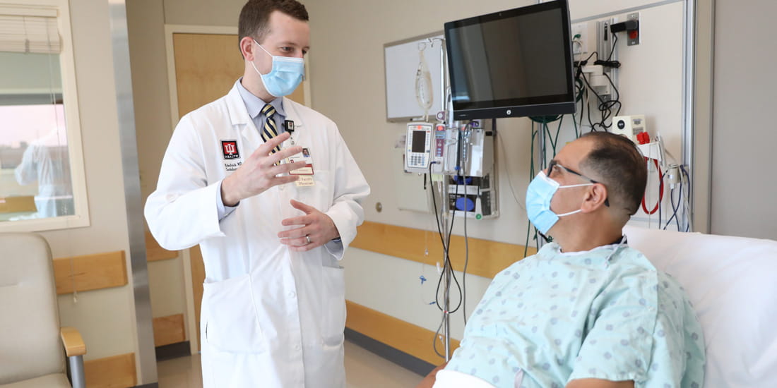 Dr. Kyle Frick speaks with a patient
