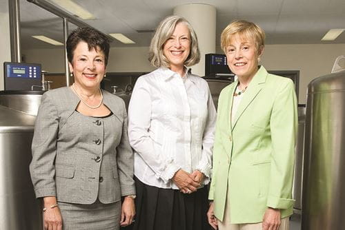 Storniolo, Rufenbarger and Clare stand in front of biobank storage