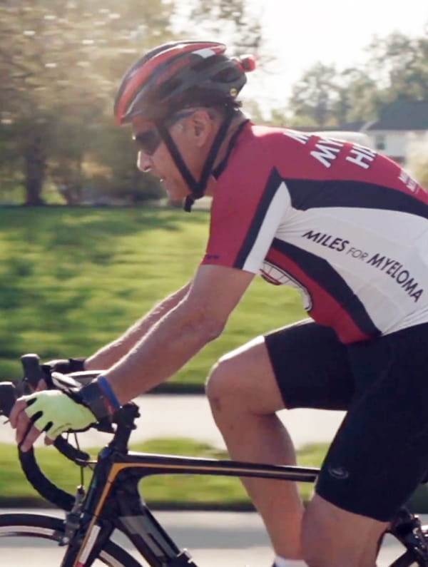 greg tamer rides his bicycle