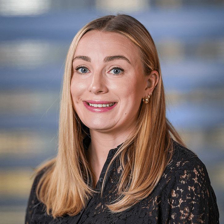 Headshot of woman in black shirt