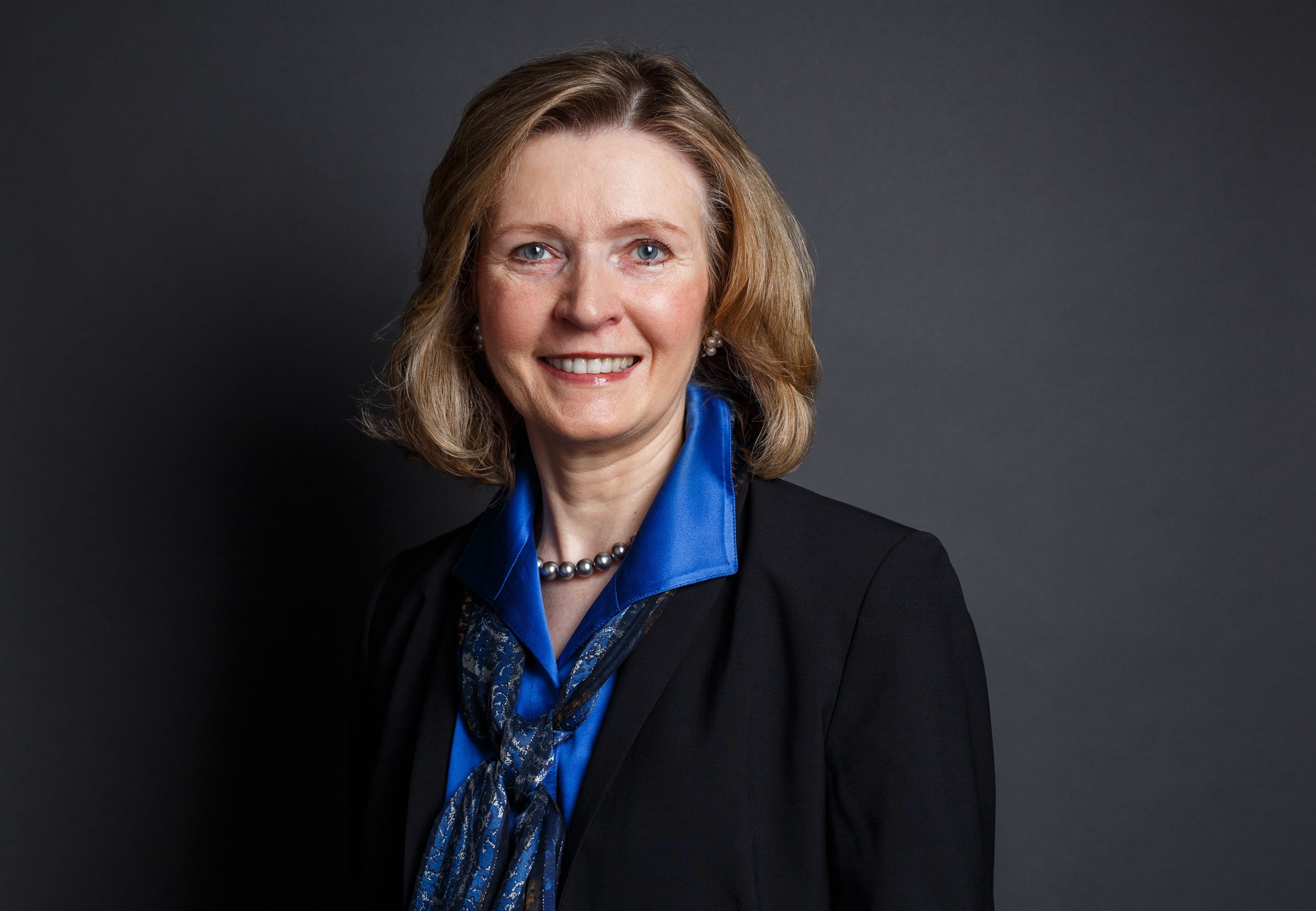 A photo of a woman smiling. 